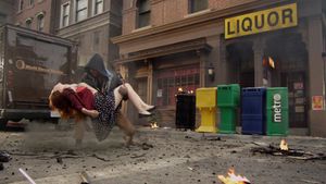 Debbie is rescued by a hooded hero after the explosion of the Los Angeles Centipede lab (AOS: "Pilot").